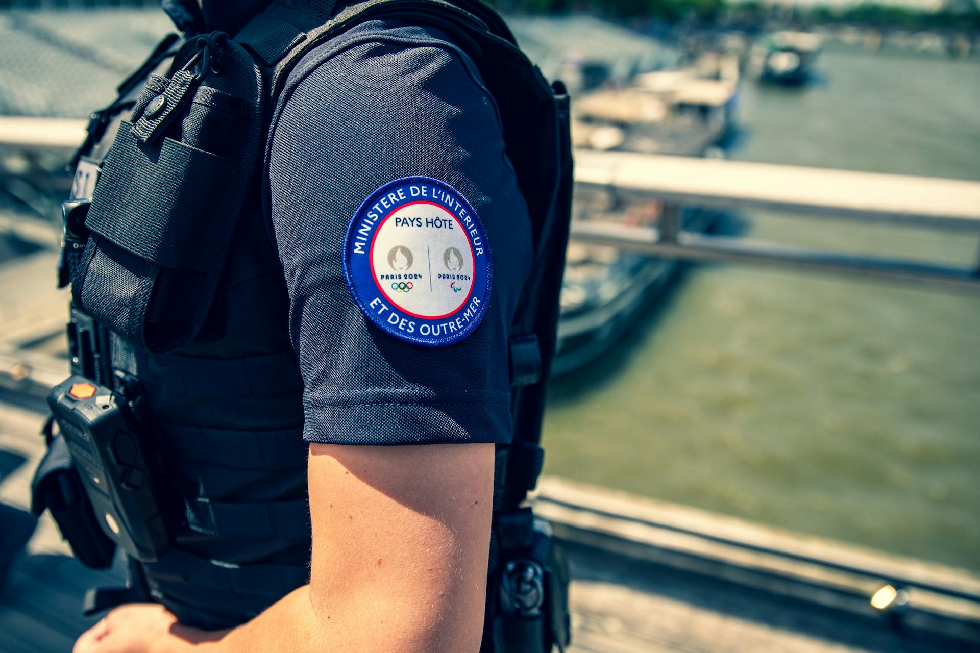 Close-up of French police officer's badge for security at Paris 2024 Olympics.