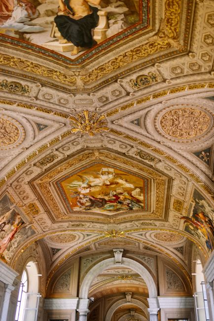 Stunning frescoes adorn the ceiling of the historic Vatican Museum in Vatican City.