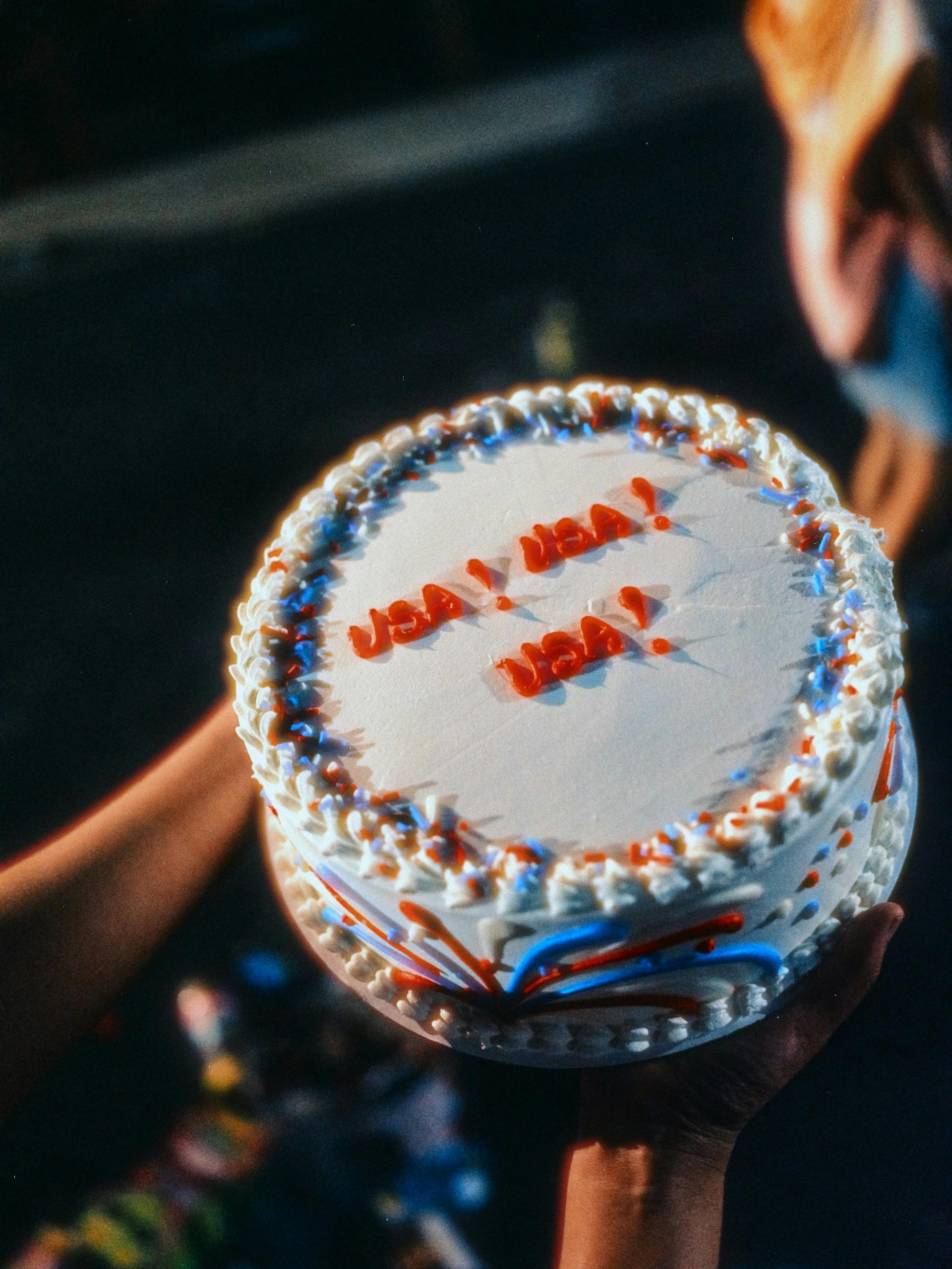 Close-up of a patriotic cake with USA decorations, symbolizing Independence Day celebrations.