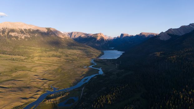 Stunning aerial landscape of a river and lake in Pinedale, Wyoming at sunset.