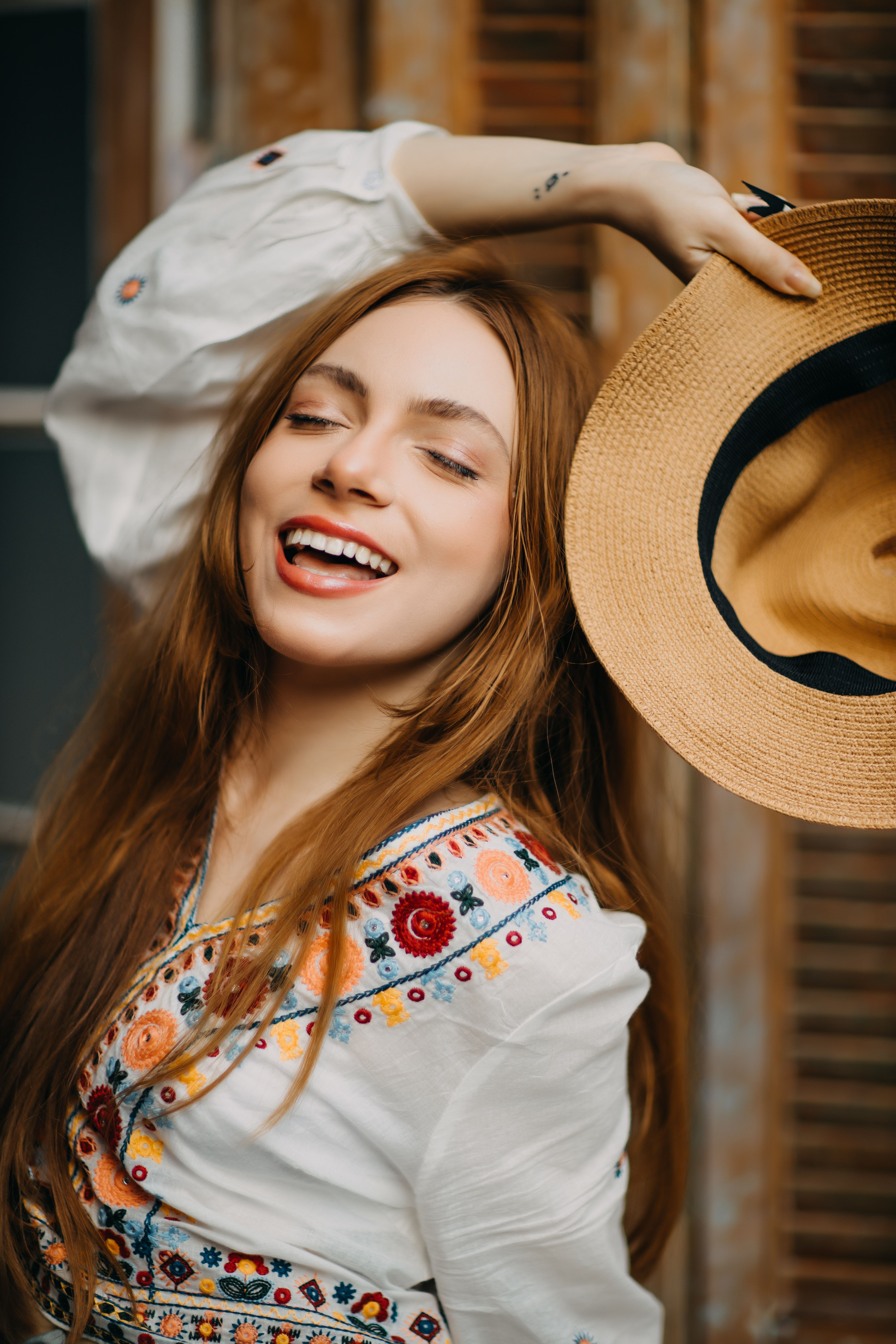 Smiling Woman in Traditional Clothing and with Hat · Free Stock Photo