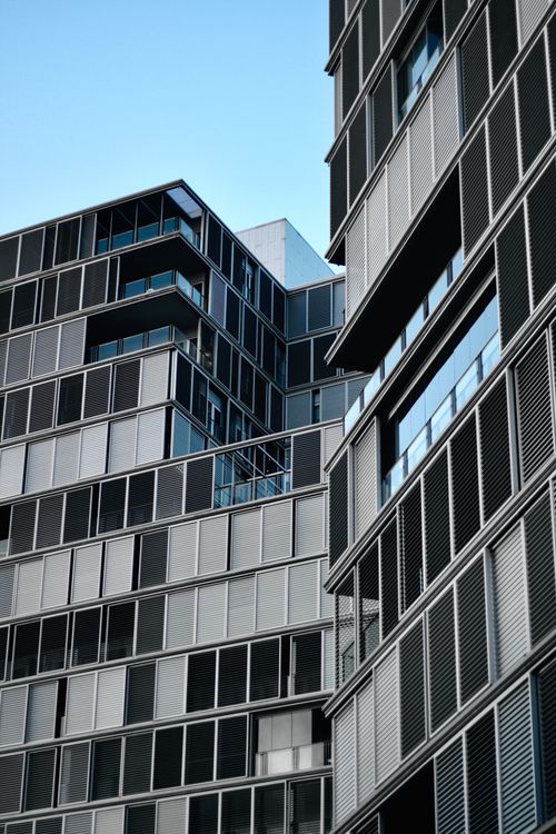 Free Close-up of a modern office building facade in Barcelona, highlighting urban architectural design. Stock Photo