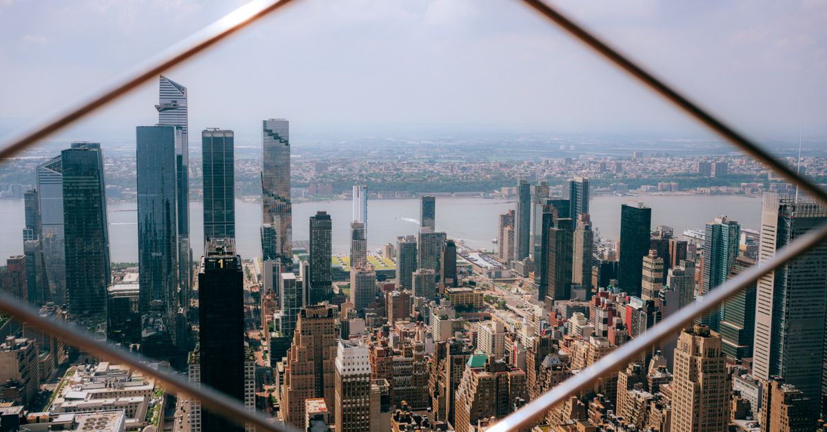 A stunning aerial view of Manhattan's skyline featuring prominent skyscrapers and urban landscape.