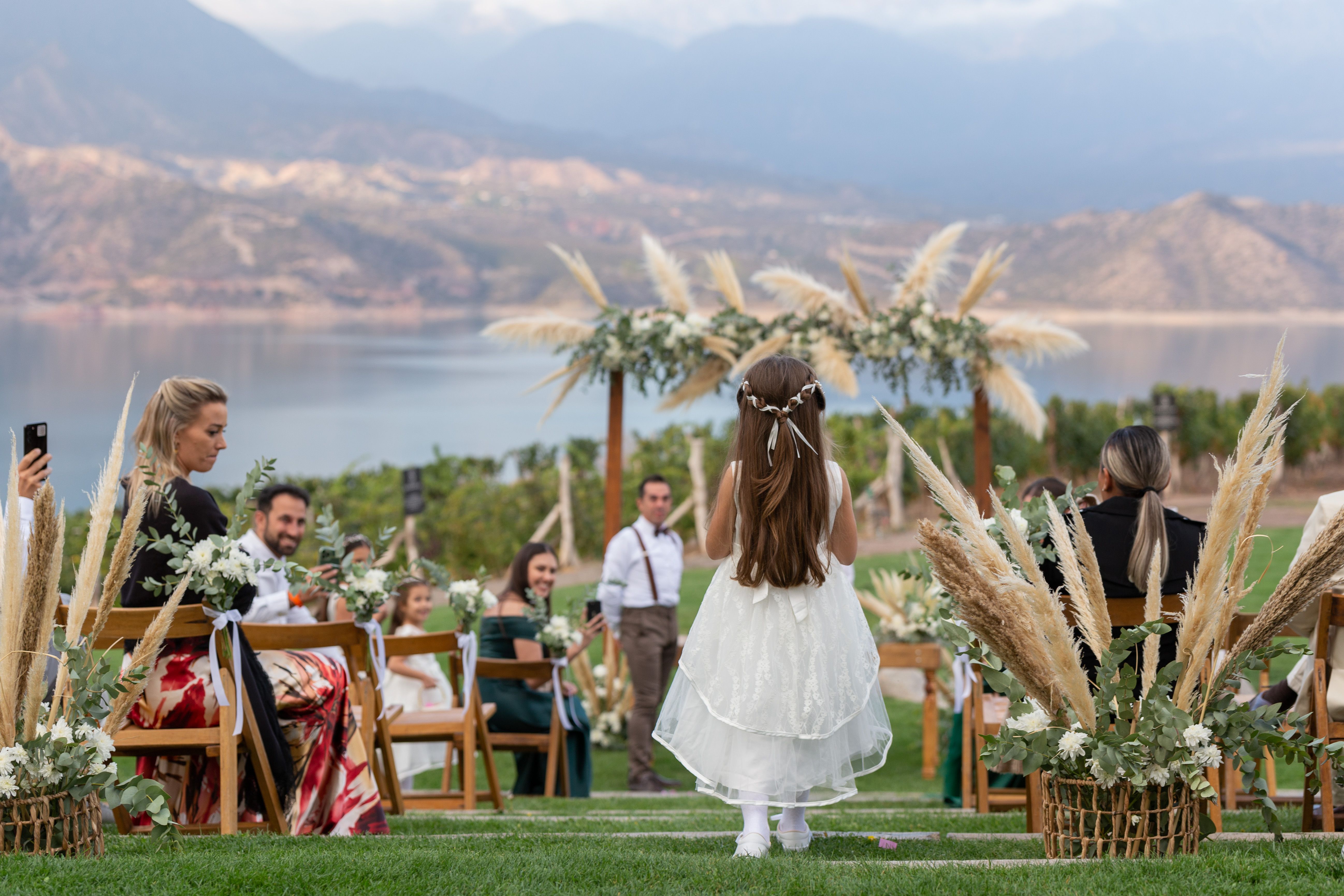 Free A picturesque outdoor wedding overlooking a serene lake and mountains in Mendoza, Argentina. Stock Photo