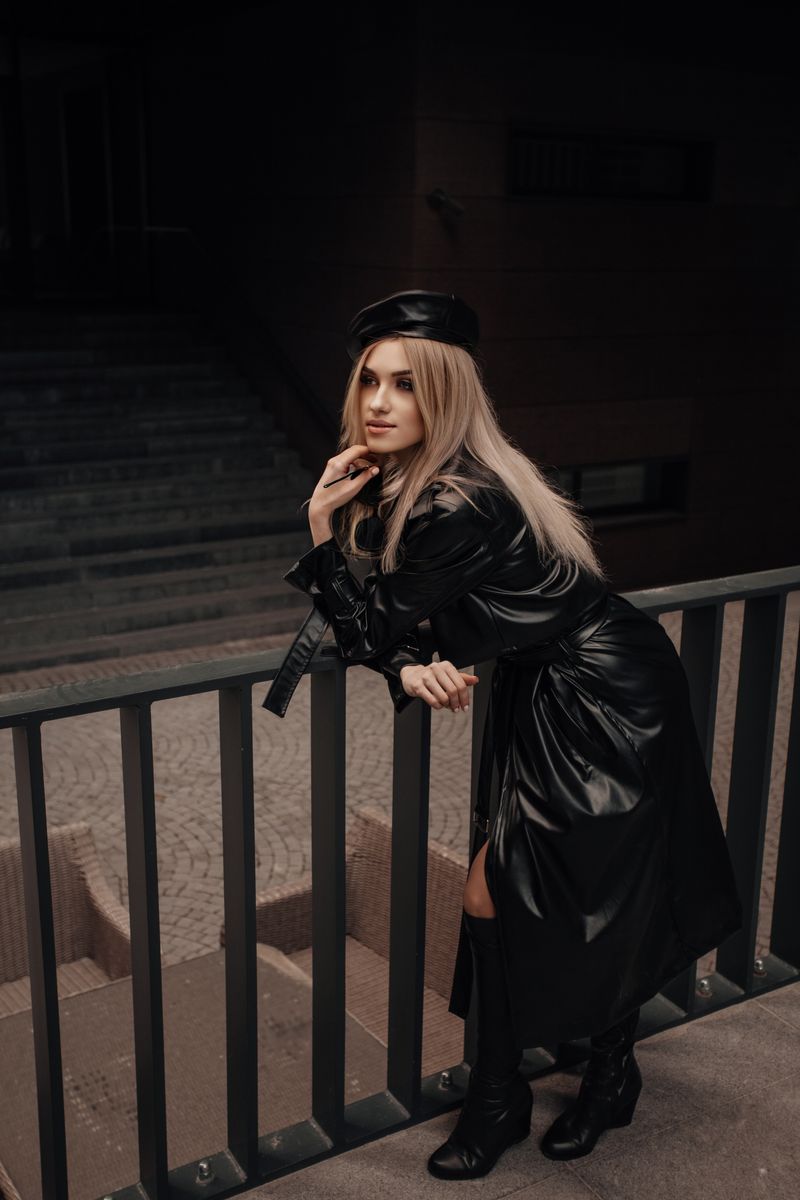 woman in black trench coat with all-black outfit