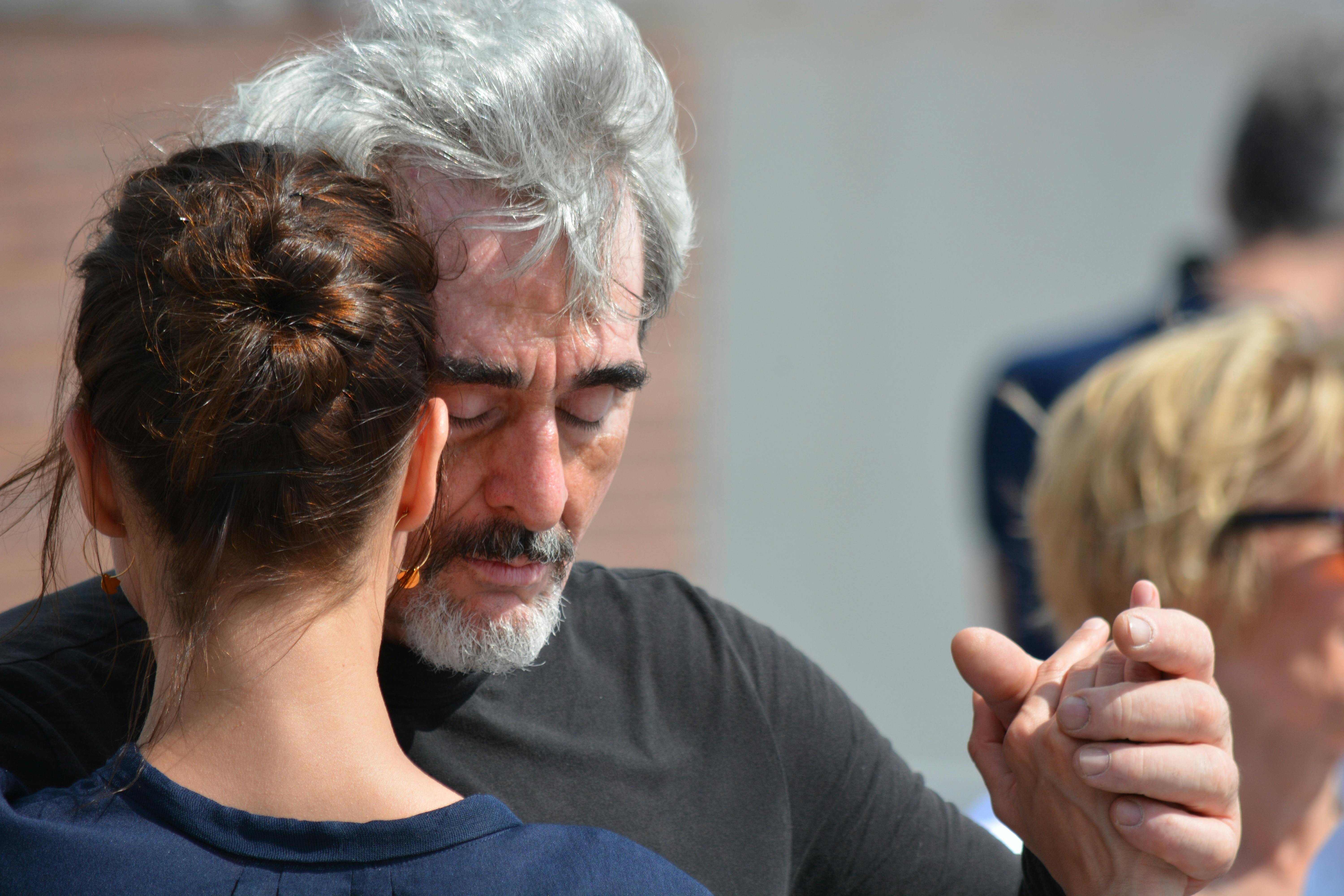 An old, dusty computer monitor glowing in a dark, abandoned room.