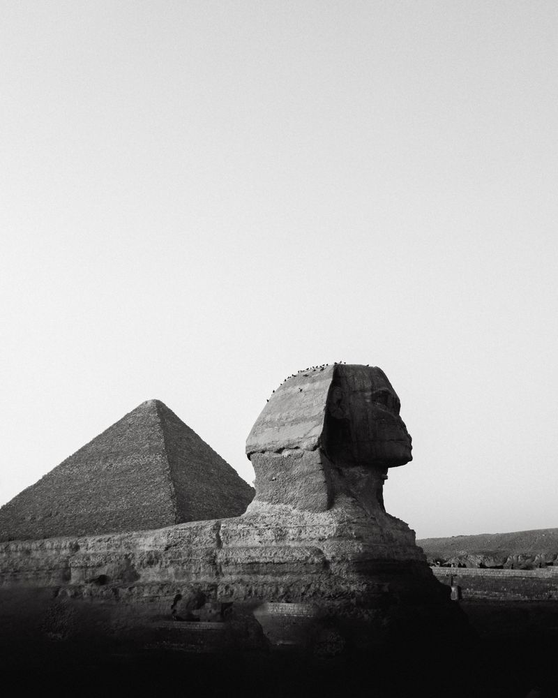 The Great Sphinx and Pyramid of Giza in Egypt under a clear blue sky