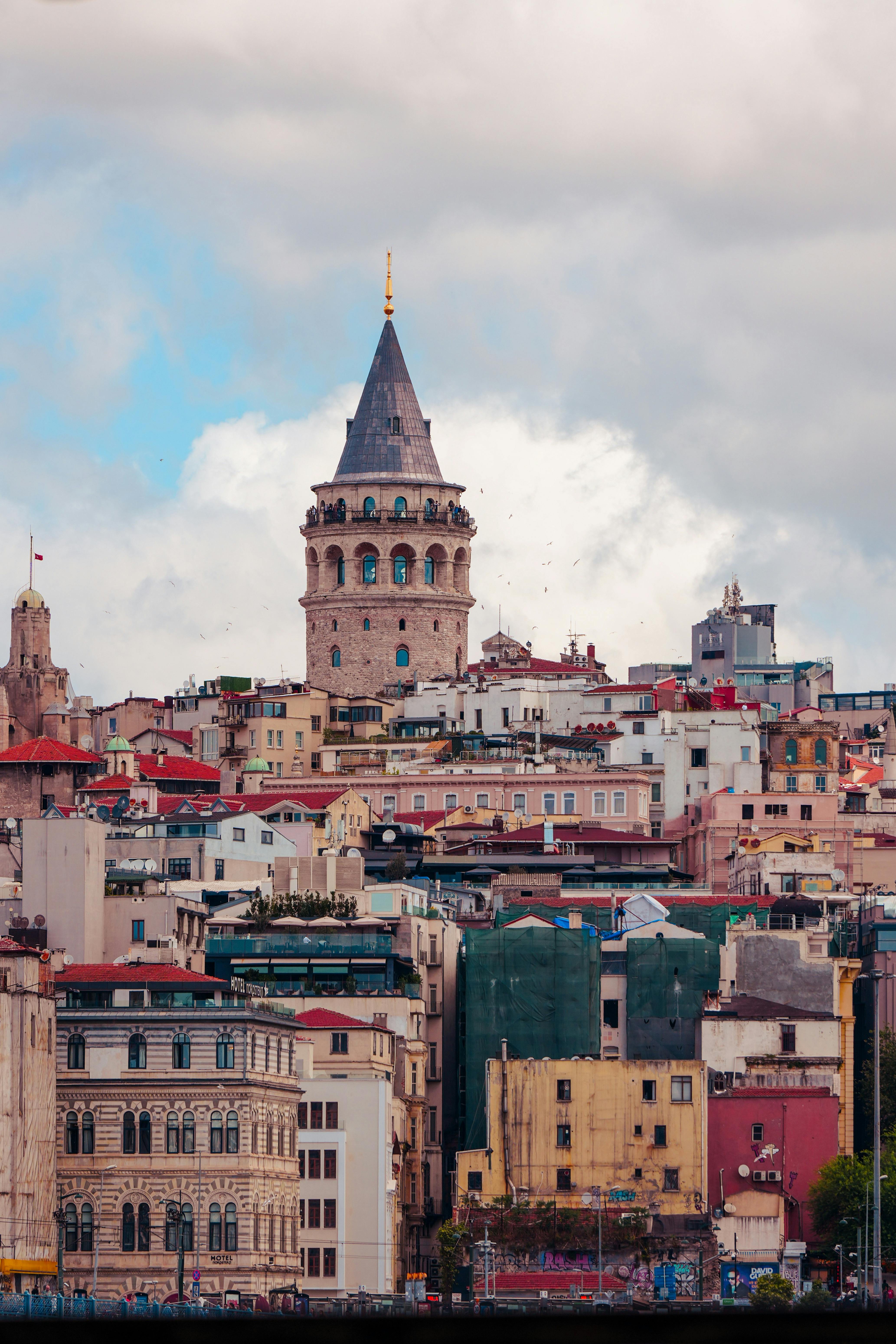 the view of a city with a tall tower in the background