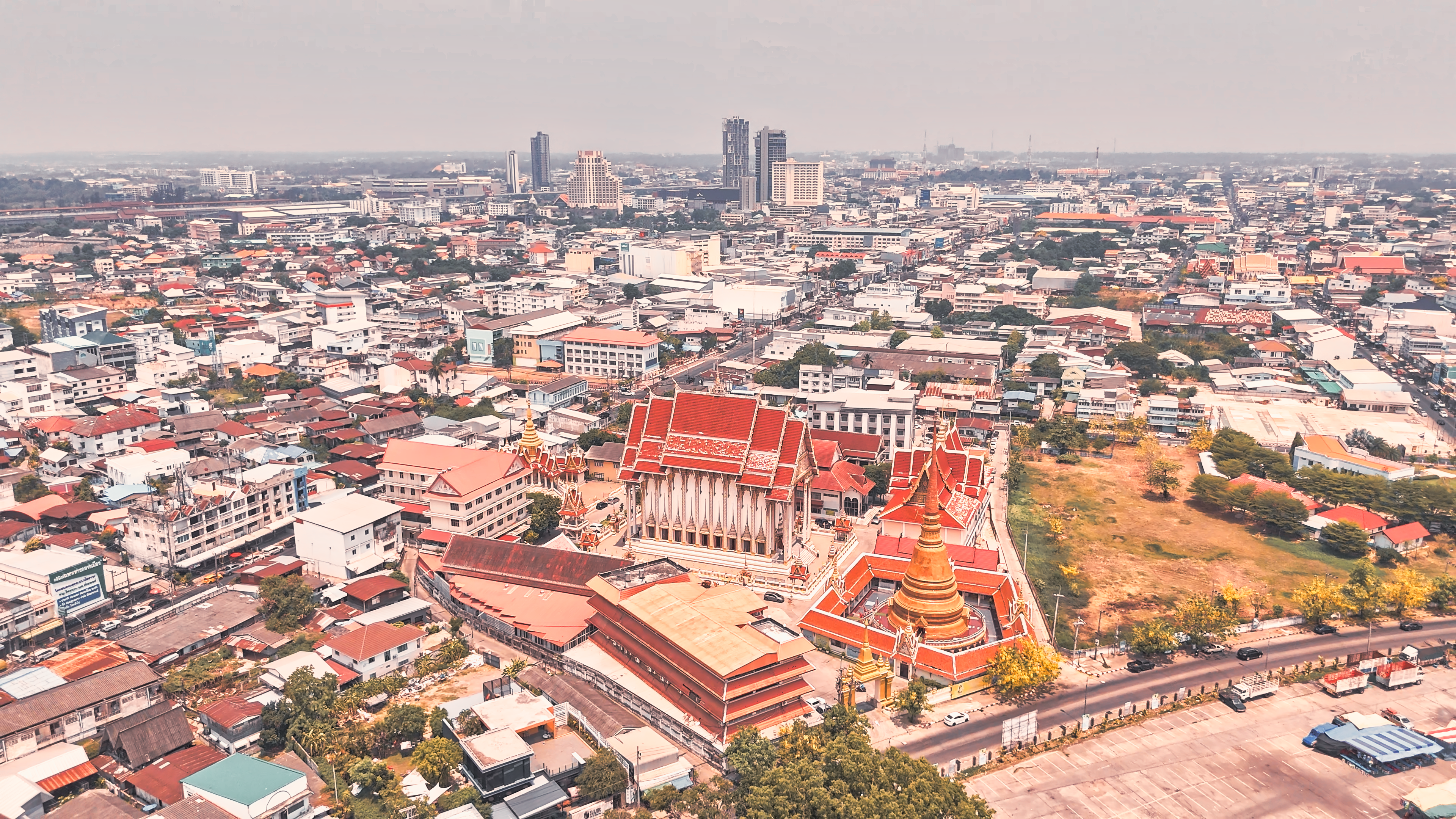 Stunning aerial view of Bangkok showcasing urban sprawl and traditional temples.