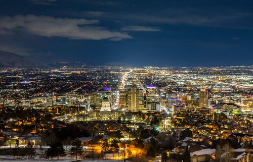 Free A breathtaking aerial view of Salt Lake City at night featuring a vibrant skyline and illuminated buildings. Stock Photo