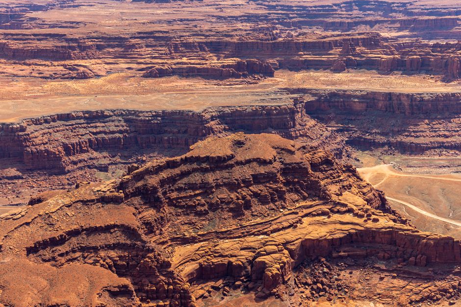 Incredible 7-Day Tour from Las Vegas to Yellowstone National Park Review 2026 - Stunning aerial shot of a vibrant, rugged canyon landscape showing geological formations.