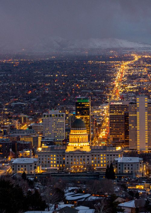 Free Captivating aerial shot of Salt Lake City's skyline illuminated at night with the Capitol building prominently visible. Stock Photo