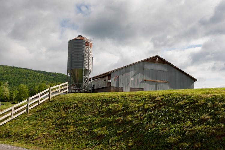 Barn Beside A Silo On The Hill Top 