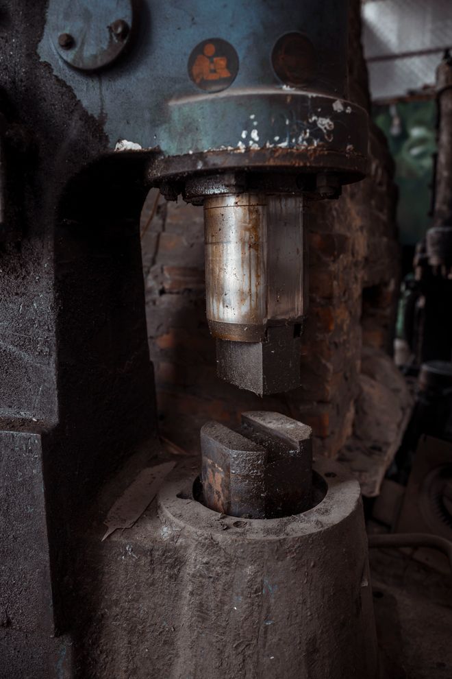 Heavy industrial machine part in a workshop. Photo by HONG SON on Pexels.