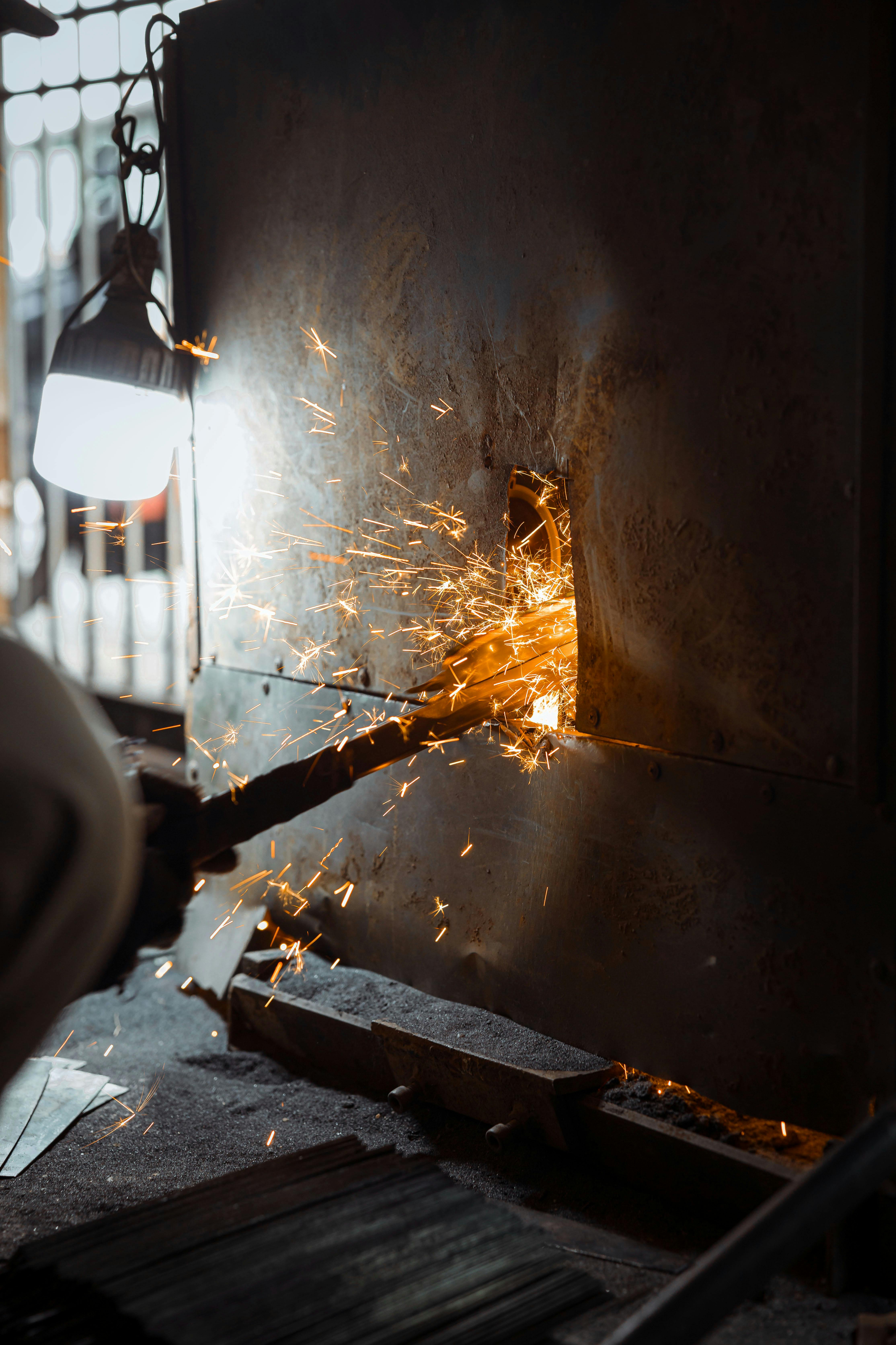 close up of sparks flying from metal grinding process