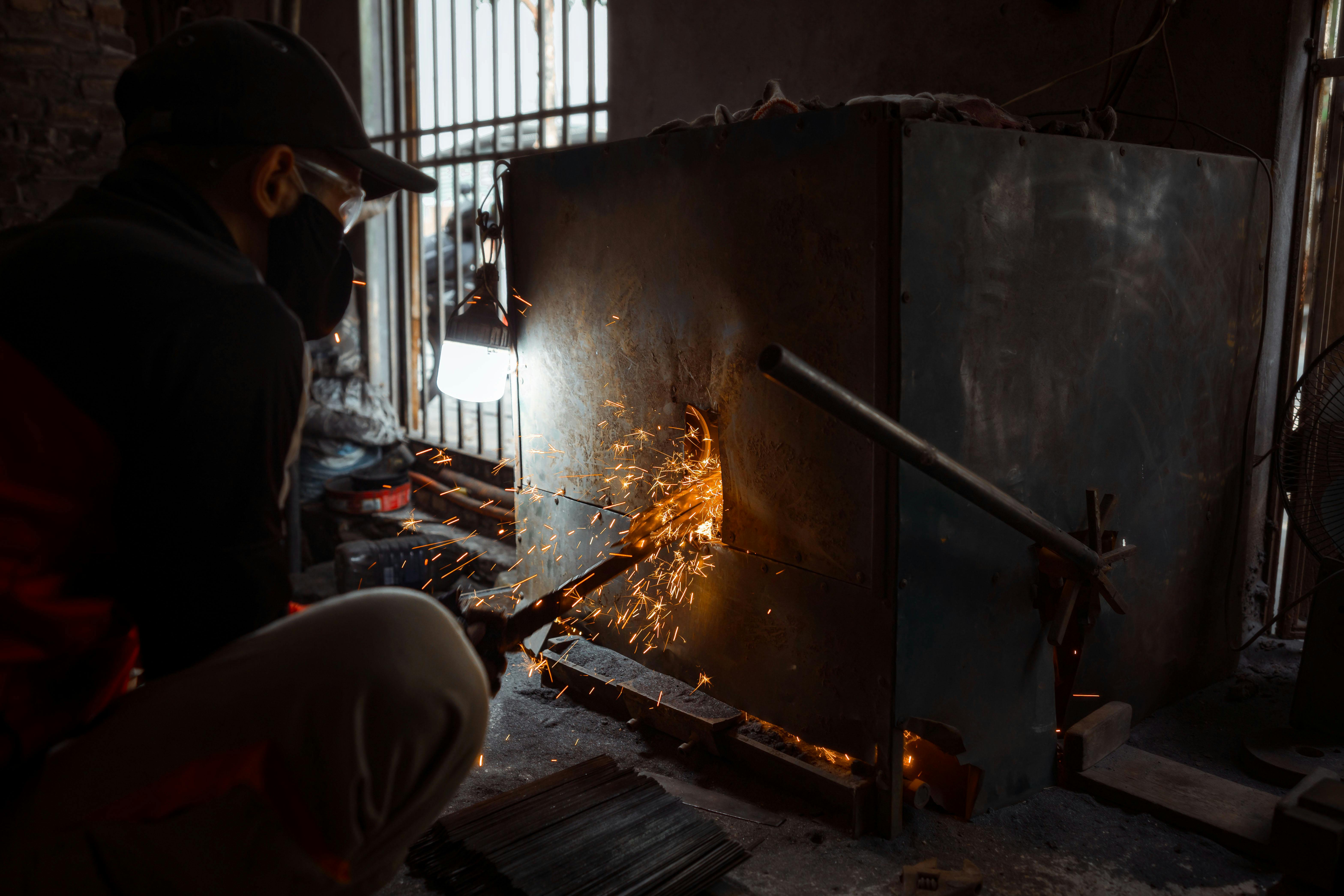 close up of sparks flying from metal grinding process