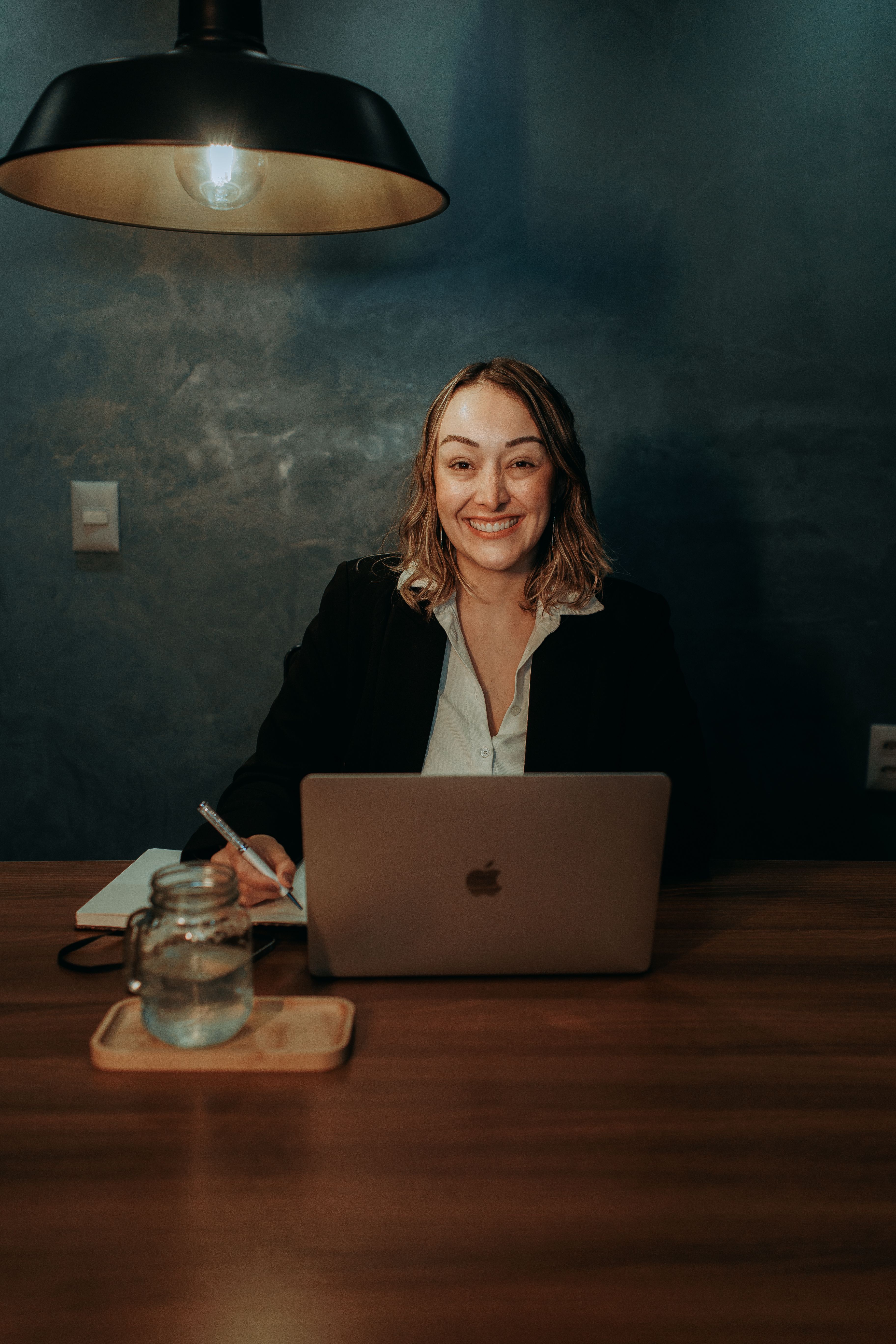 Founder smiling in a bright studio office
