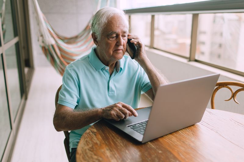 Older man enjoying a video call with family
