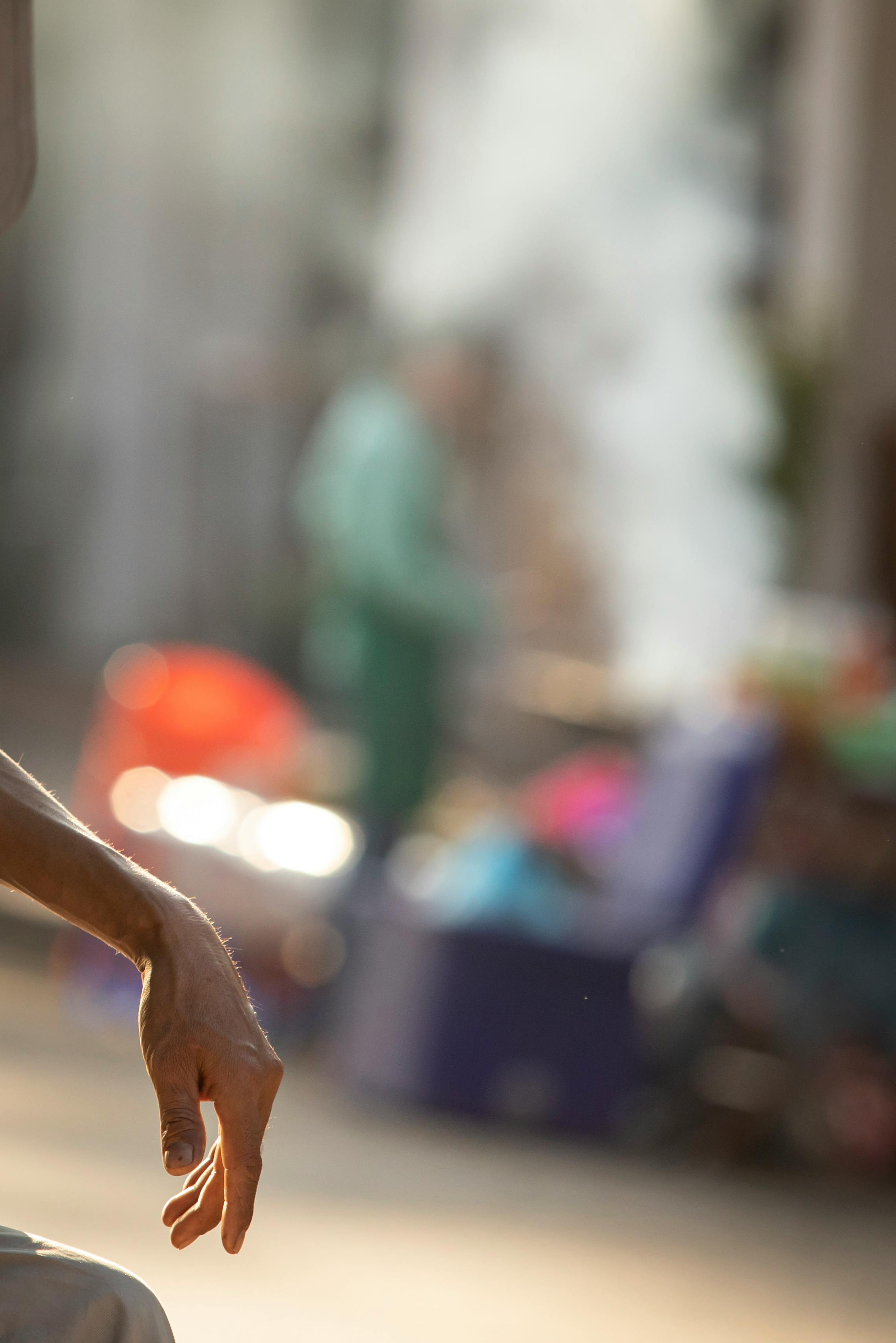 close up of a persons hand on the background of the street