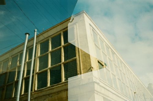 Free A creative double exposure photograph capturing a building in Saint Petersburg with modern glass windows. Stock Photo