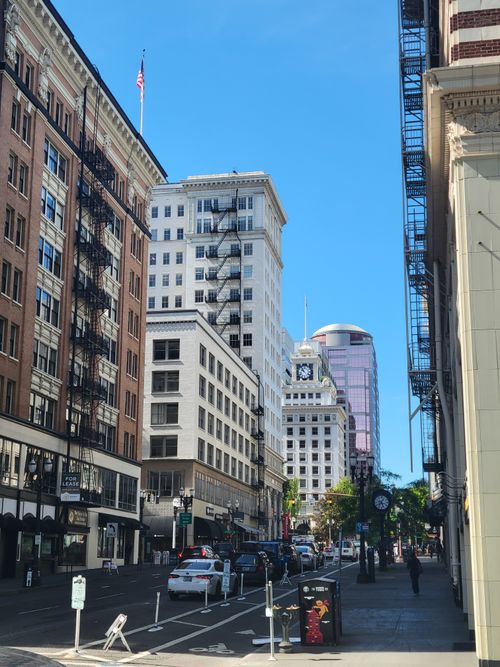 Free A vibrant street scene featuring high-rise buildings and urban architecture in downtown Portland, Oregon. Stock Photo
