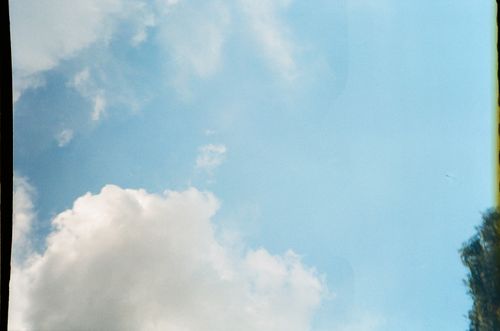 Free A scenic view of a blue sky with white clouds and a hint of nature from Moscow. Stock Photo