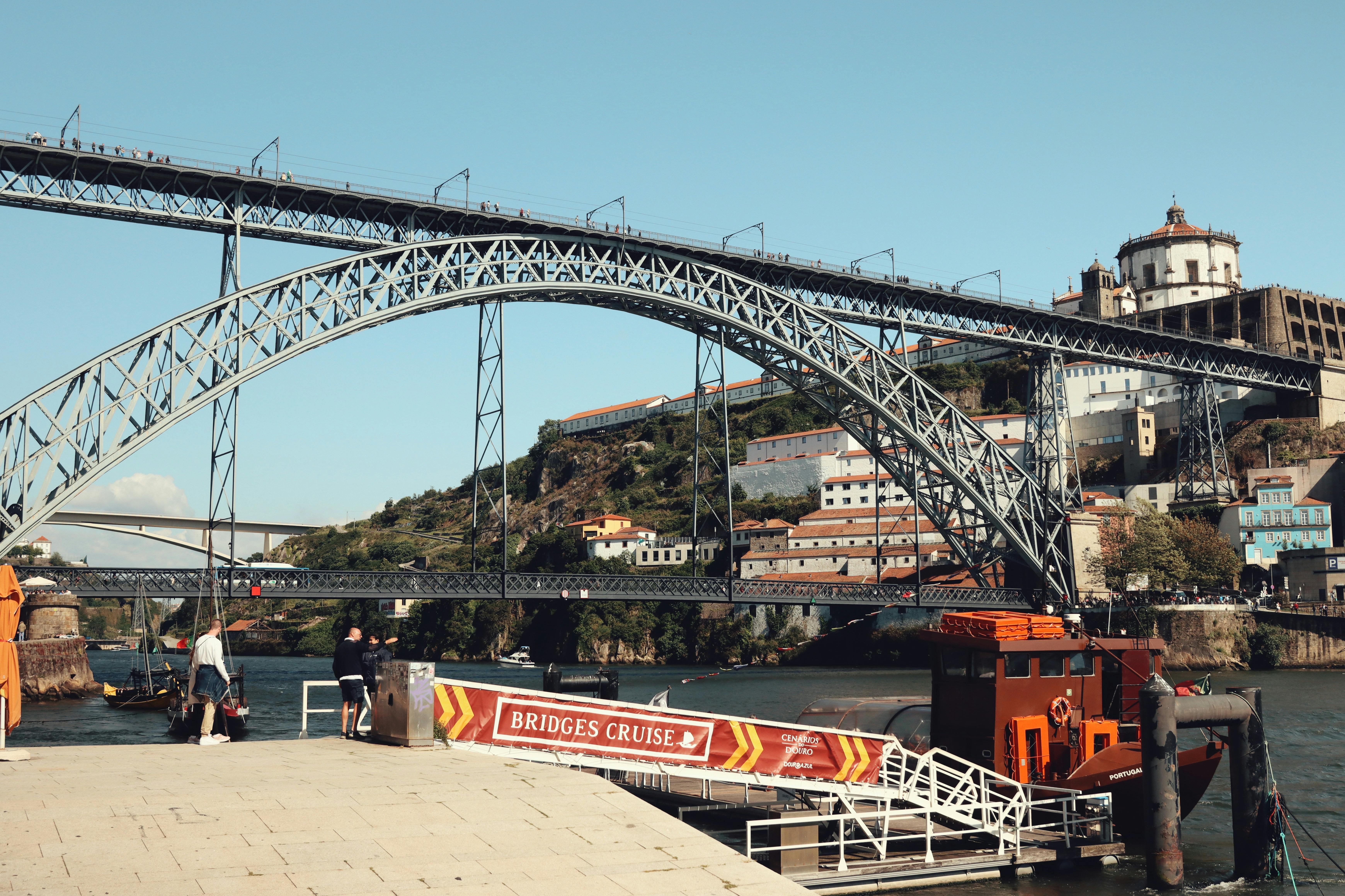 A couple enjoying champagne on a private balcony in The Retreat on a Celebrity cruise ship at sunset.