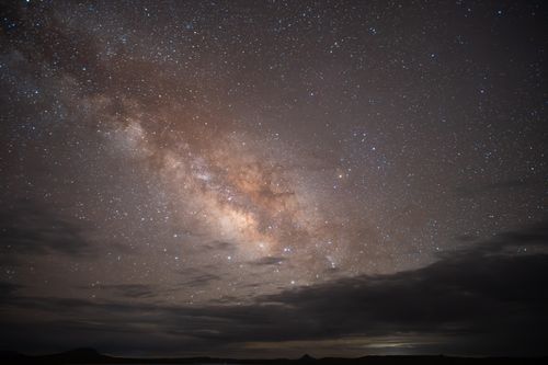 Free Marvel at the bright Milky Way galaxy against the starry night sky, showcasing cosmic beauty. Stock Photo