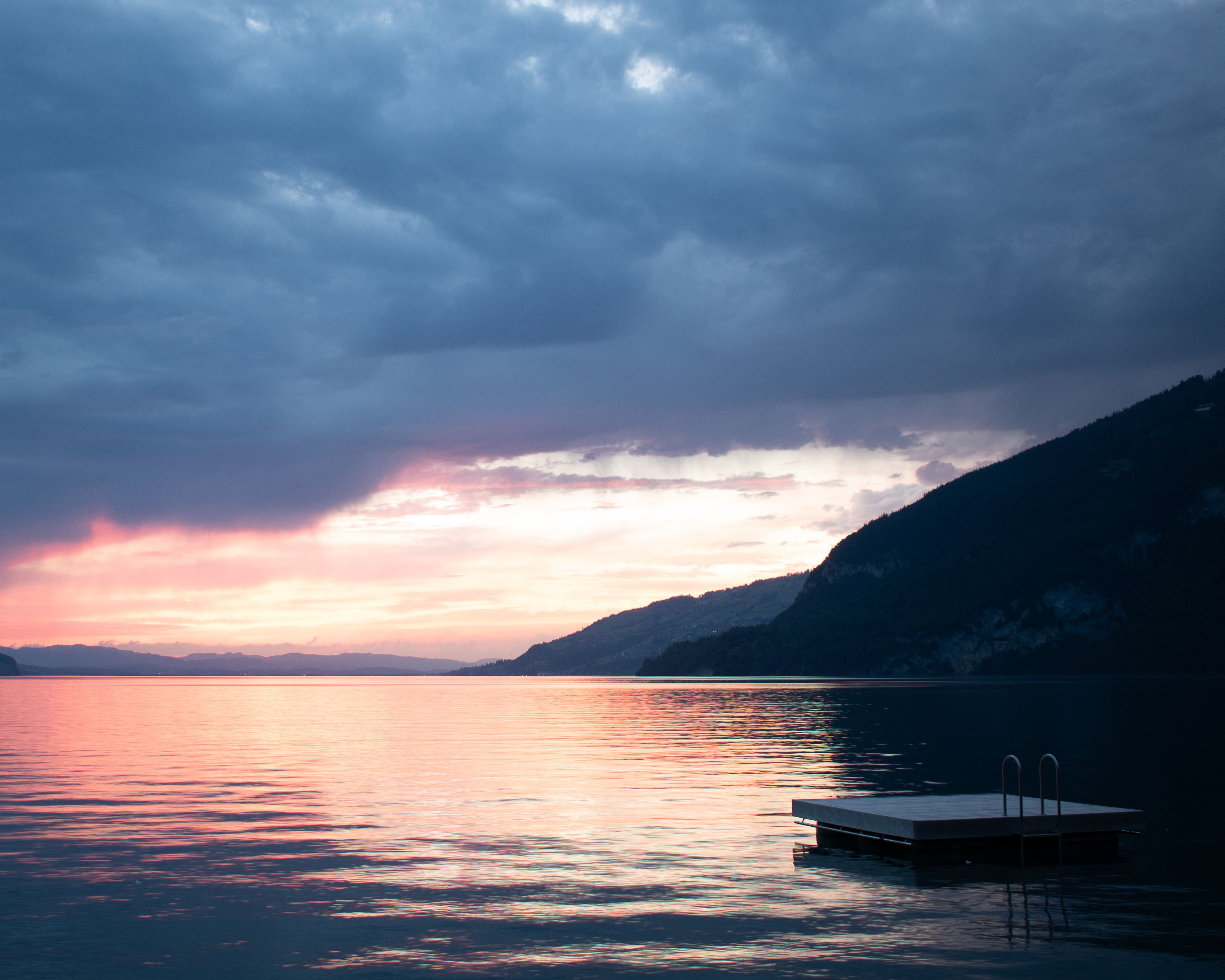 Storm Cloud over Lake at Sunset · Free Stock Photo