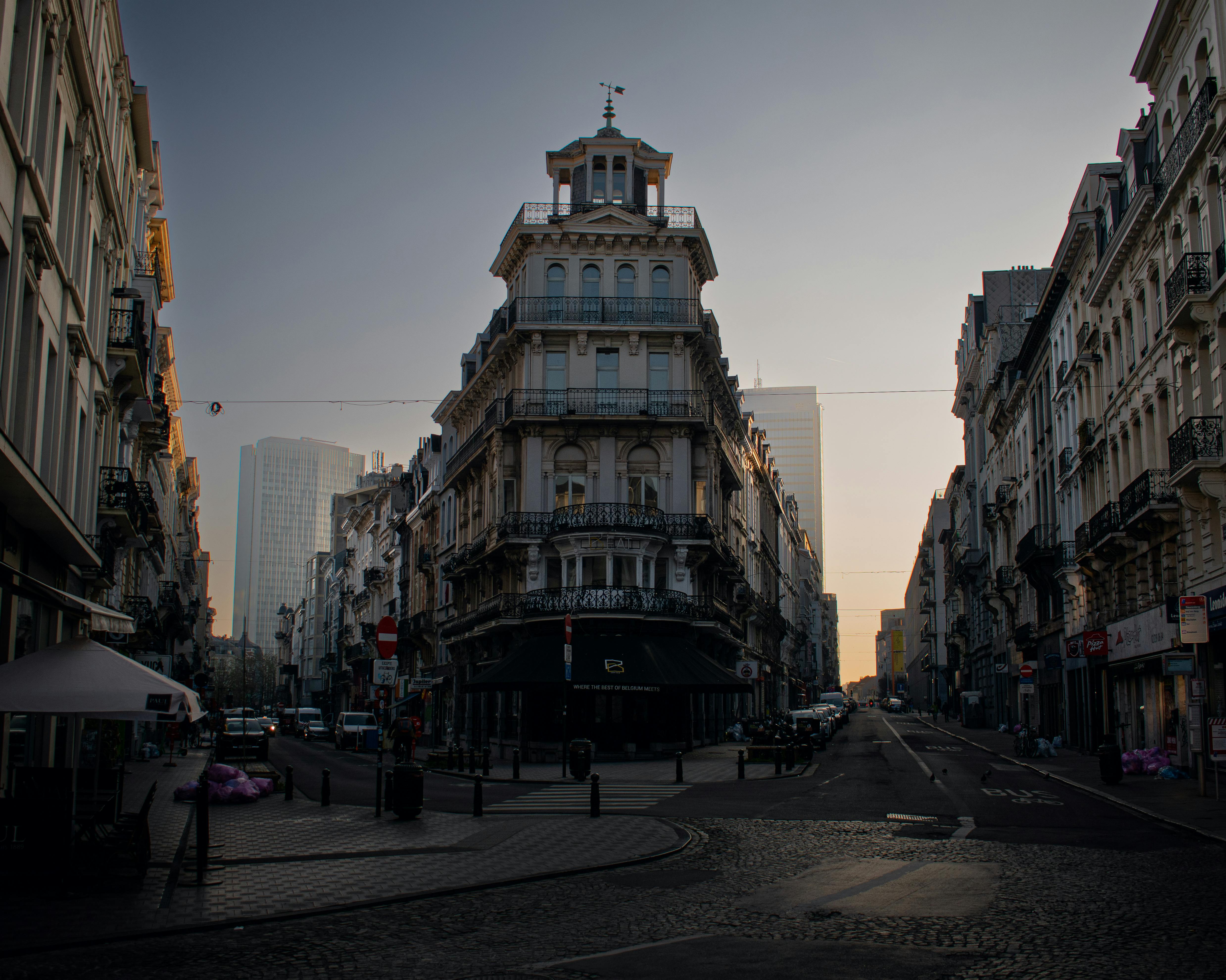 Classic European architecture in Brussels city at sunset, showcasing a mix of historic and modern buildings.