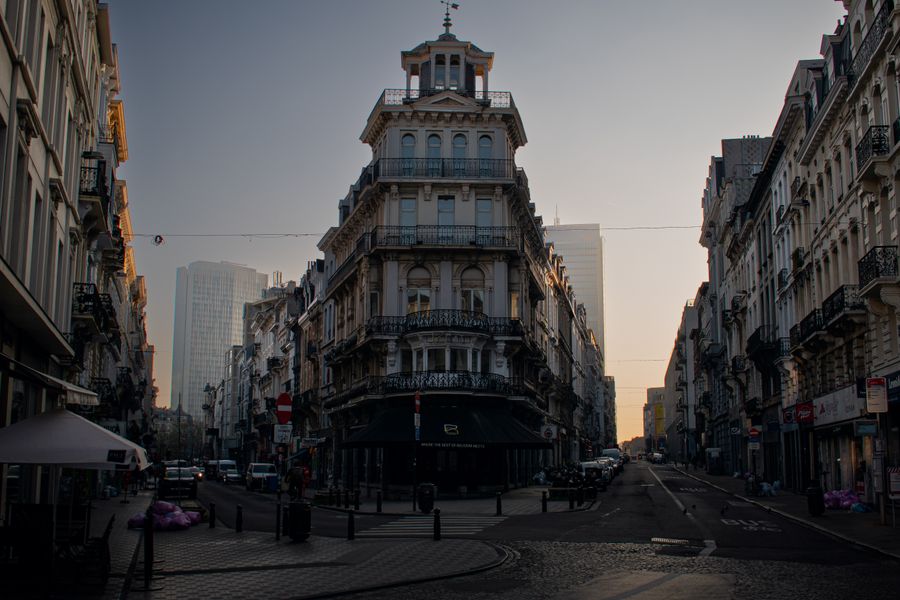 Classic European architecture in Brussels city at sunset, showcasing a mix of historic and modern buildings.