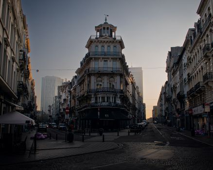 Classic European architecture in Brussels city at sunset, showcasing a mix of historic and modern buildings.