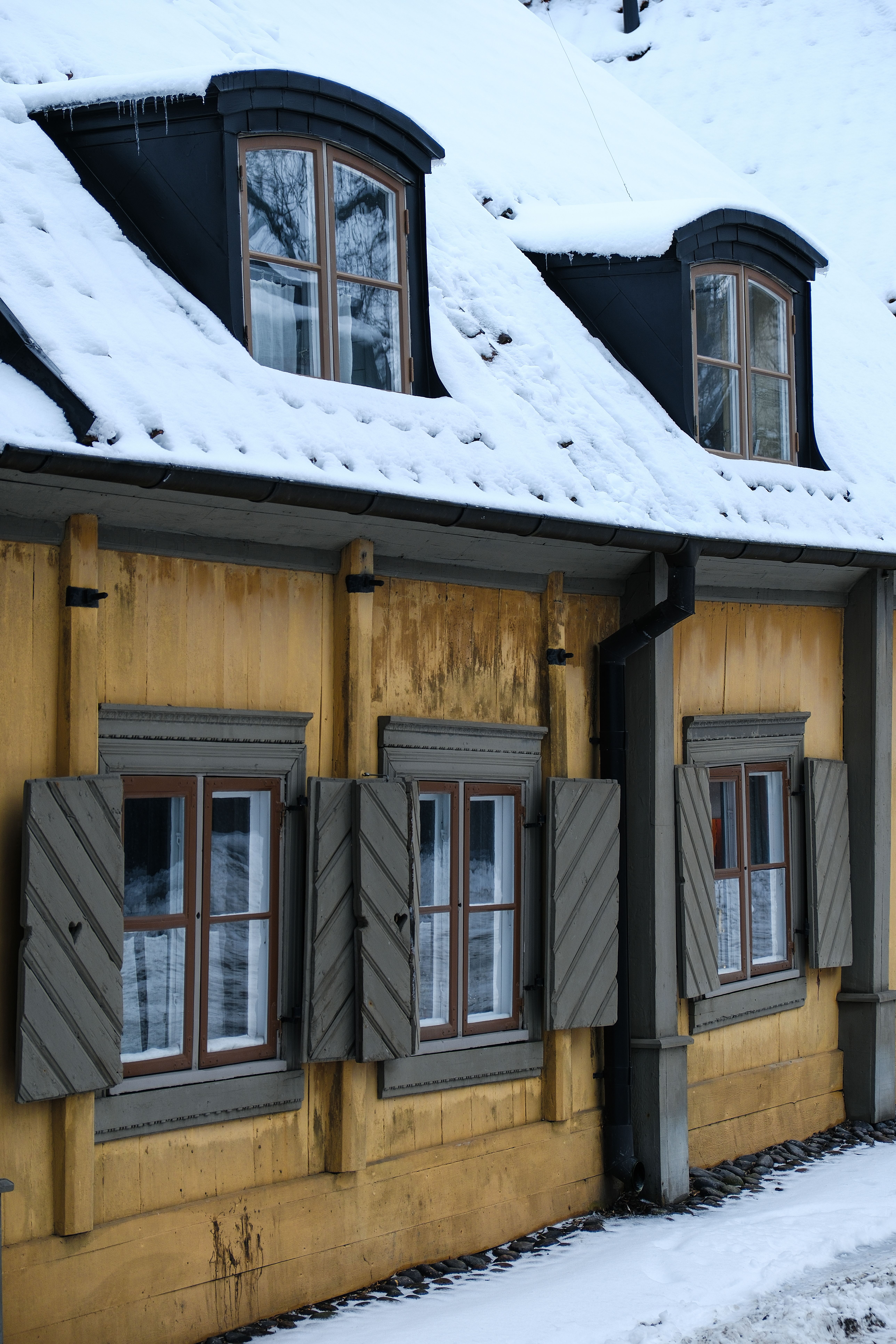 Exterior of a House with Snow on the Roof · Free Stock Photo