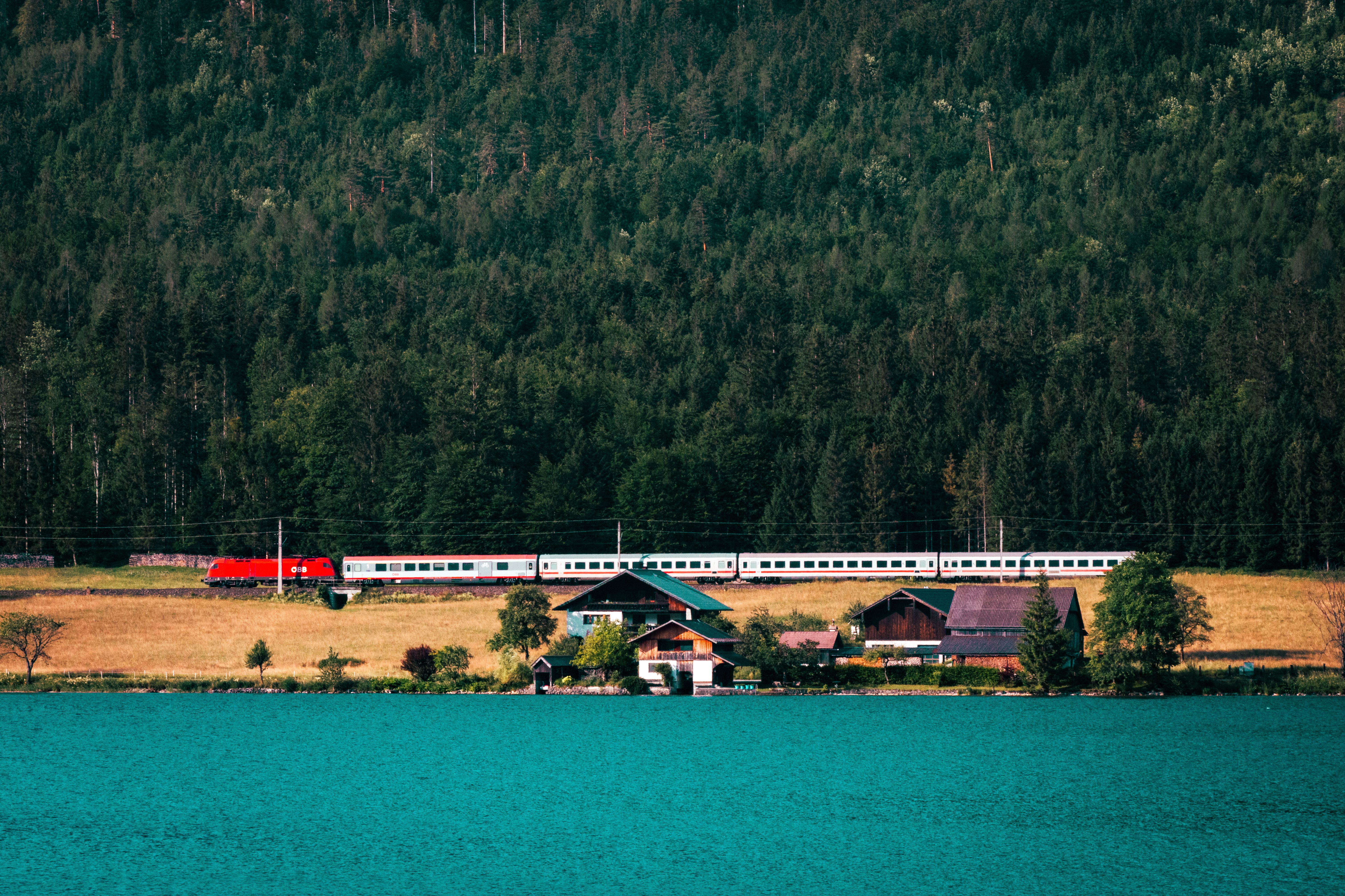 Modern ÖBB train traveling through the scenic Austrian countryside