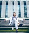 Man Wearing White Suit Jacket and White Pants