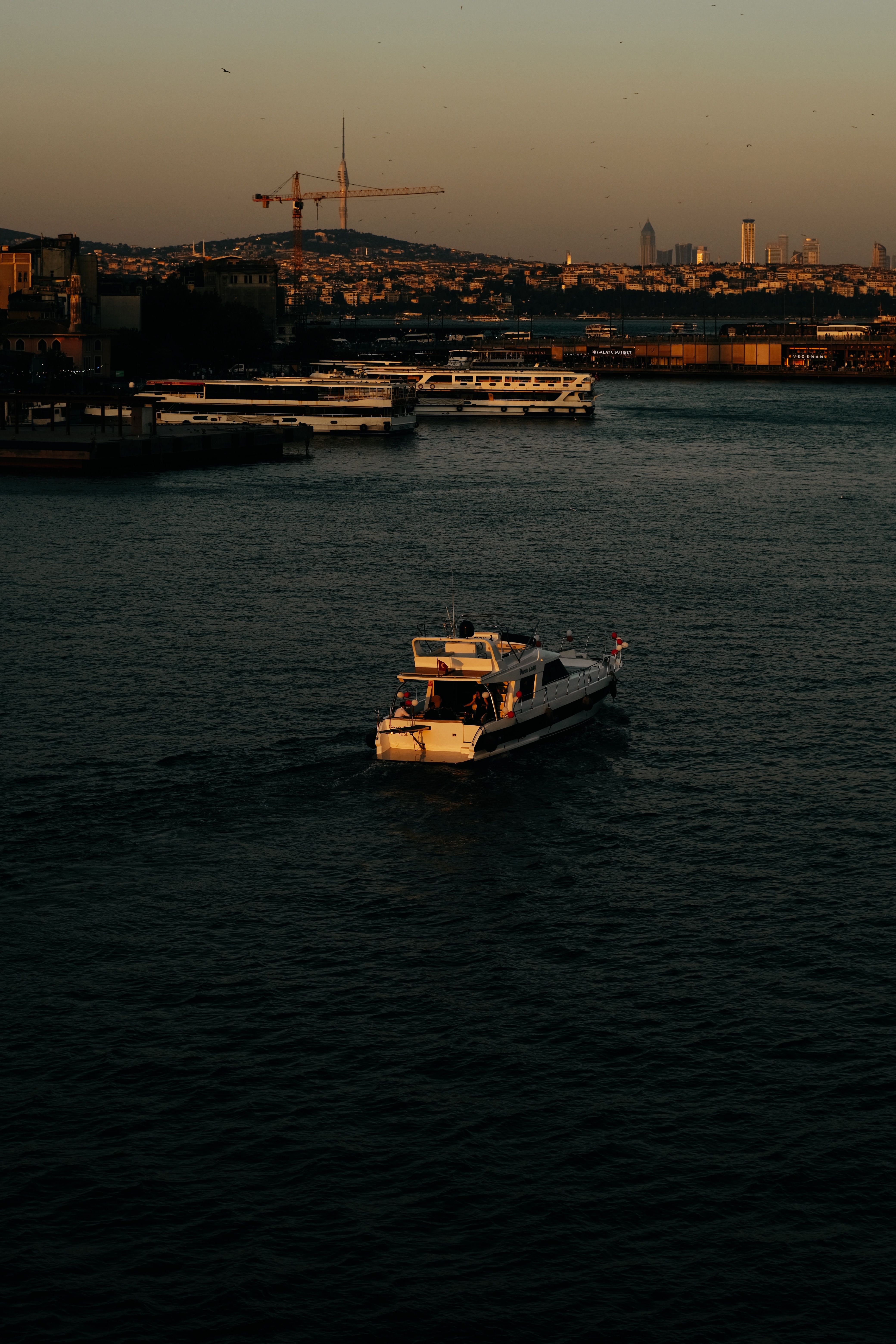 Motor Yacht Sailing on Sea Coast in Istanbul at Sunset · Free Stock Photo