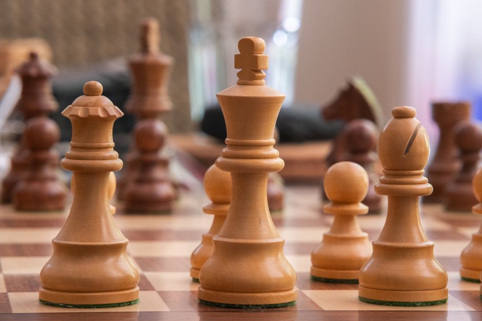 chess pieces on wooden board