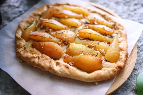 Free Delicious pear tart with rustic crust, perfect for dessert lovers. Stock Photo