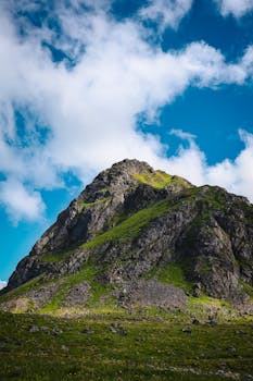 Beautiful mountain landscape in Eggum, Nordland, with vibrant green and blue hues.