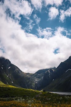 Breathtaking view of mountains and clouds in Eggum, Nordland, Norway.