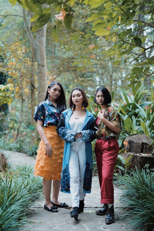 Three Ladies In Different Style Of Clothes