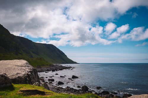 Free Stunning coastline view in Eggum, Norway with dramatic cliffs and clear blue sky. Stock Photo
