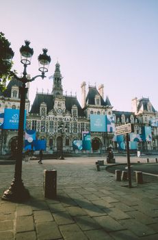 Beautiful view of the Hôtel de Ville in Paris during the day with urban surroundings and clear skies.