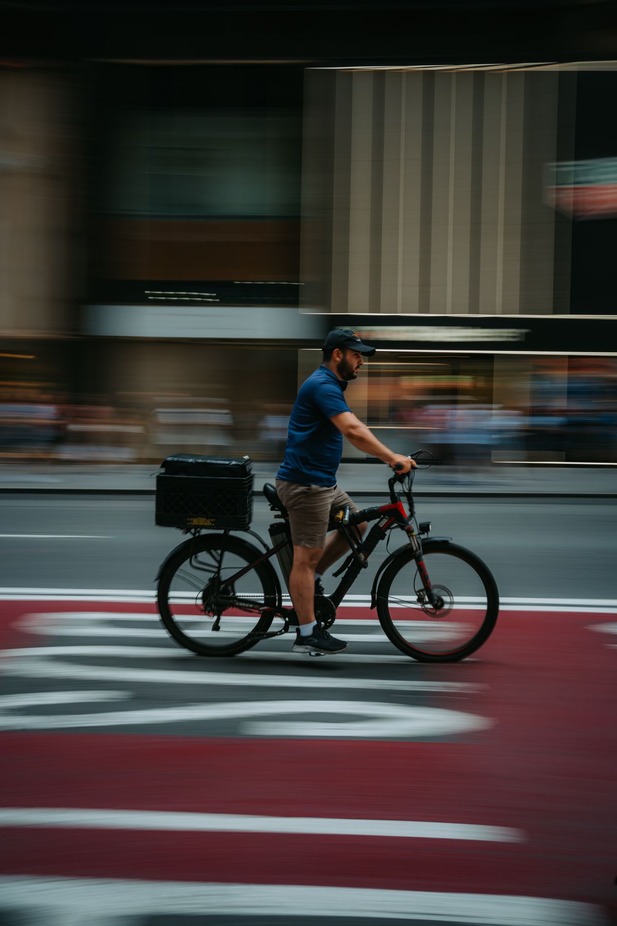 Cyclist moving through a contemporary city environment