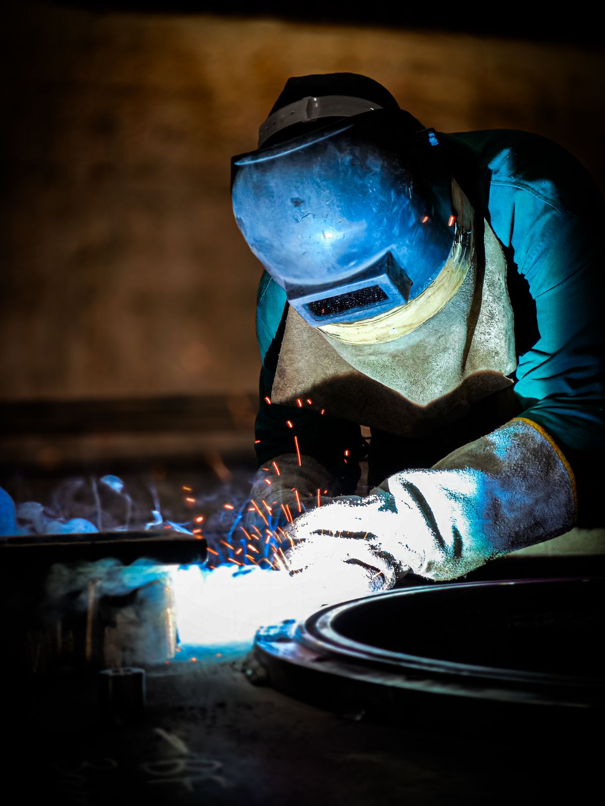 Close-up of welding work in a dimly lit workshop