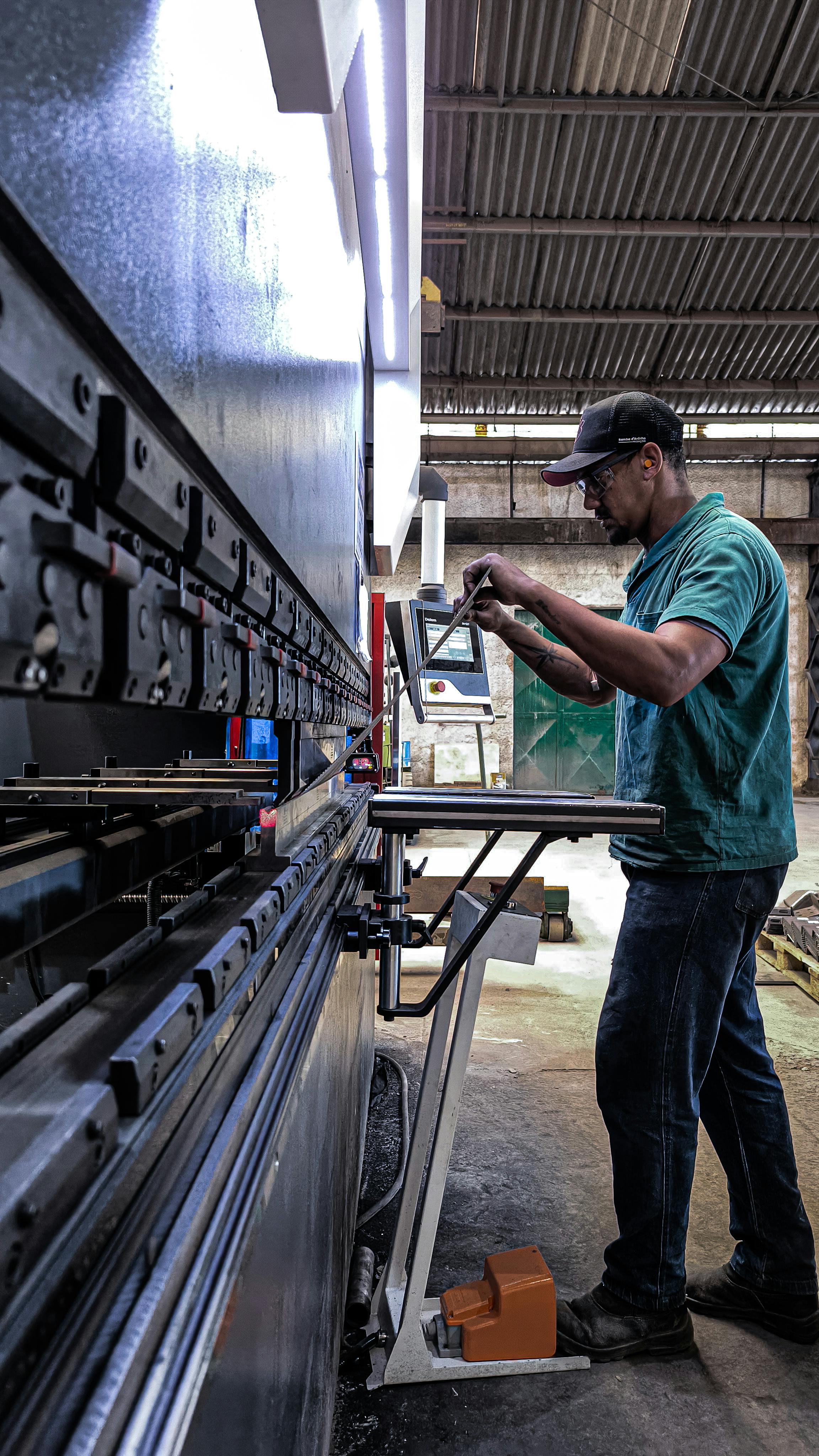 A man is working on a machine in a factory