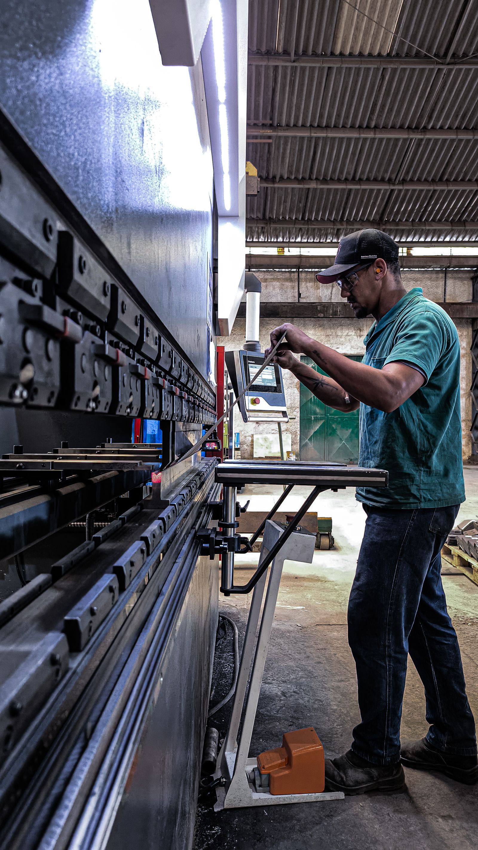 Manufacturing worker operating industrial machinery