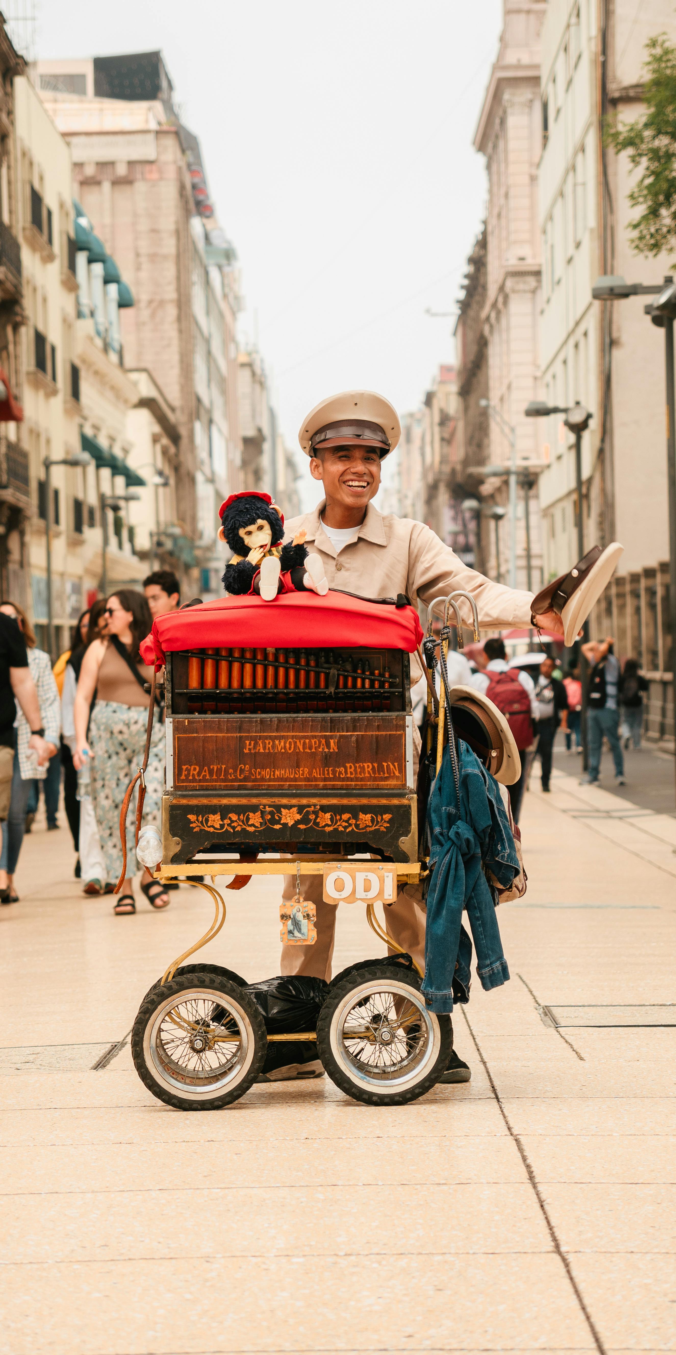 A cheerful street performer with a puppet in a bustling urban setting in Ciudad de México.