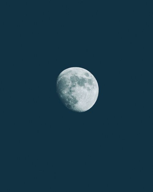 Free A stunning full moon captured against a dark clear night sky, highlighting lunar details. Stock Photo
