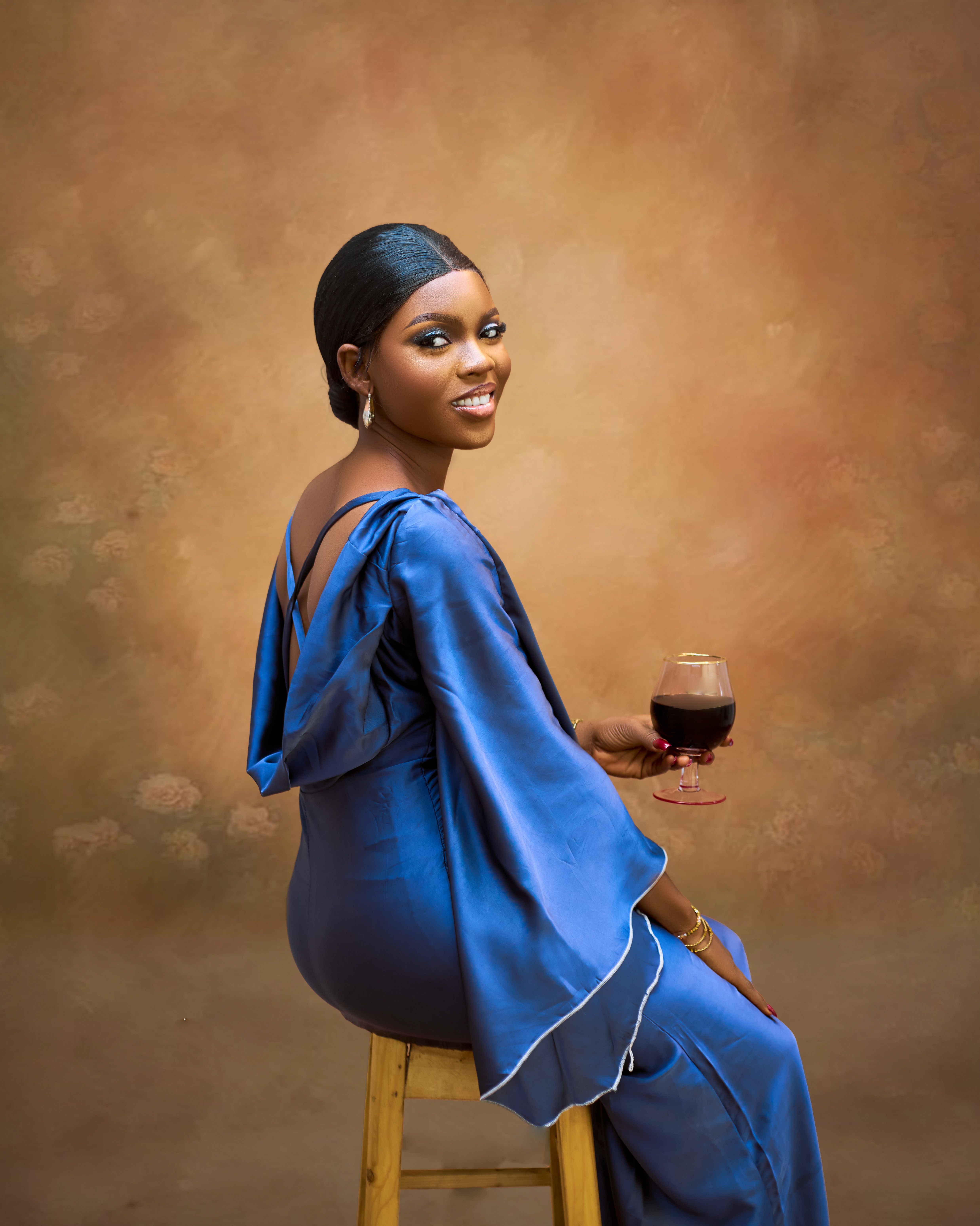 Elegant Woman in a Blue Dress Sitting with a Glass of Wine · Free Stock ...